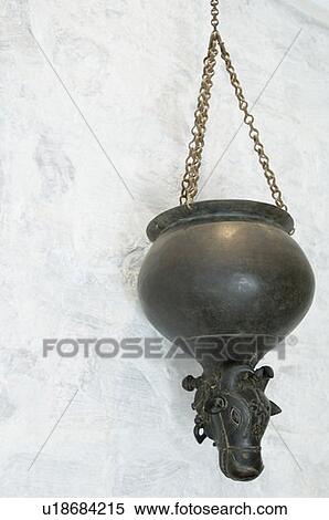 Stock Photography - Low angle view of a hanging decorative urn. Fotosearch