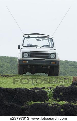Stock Image - Low angle view of a jeep. Fotosearch