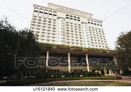 Stock Image - Low angle view of a multi-storied building. Fotosearch