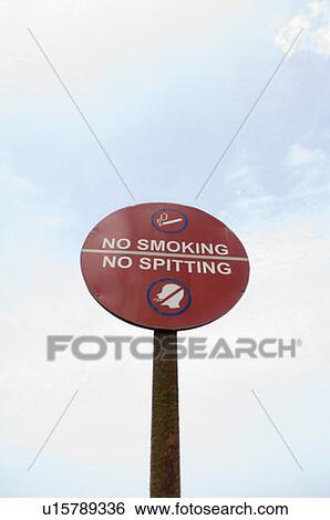 Stock Photograph - Low angle view of a warning signboard. Fotosearch