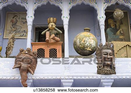 Stock Photo - Low angle view of antique handicraft objects displayed in front of a house, Pushkar, Rajasthan, India. Fotosearch