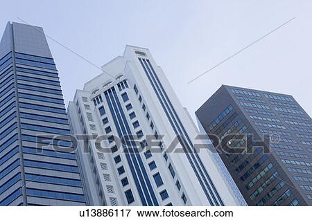 Low angle view of skyscrapers, Singapore View Large Photo Image Stock Photo - Low angle view of skyscrapers, Singapore. Fotosearch