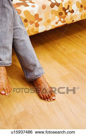 Low section view of a woman with henna tattooed feet View Large Photo Image Stock Photograph - Low section view of a woman with henna tattooed feet. Fotosearch