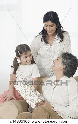 Mature woman with her daughter and granddaughter smiling View Large Photo Image Stock Photography - Mature woman with her daughter and granddaughter smiling. Fotosearch