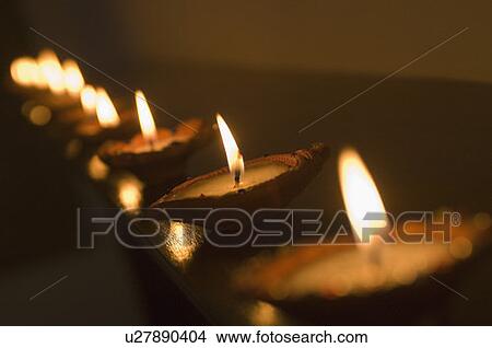 Picture - Oil lamps in a row. Fotosearch