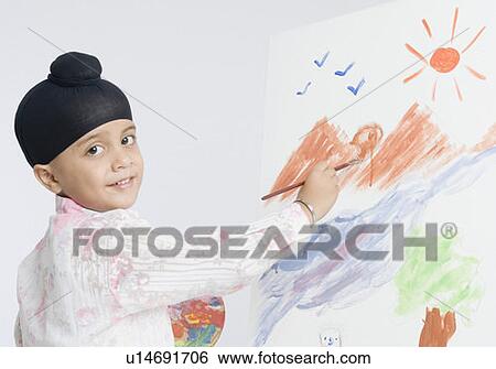 Portrait of a boy painting and smiling View Large Photo Image Stock Photograph - Portrait of a boy painting and smiling . Fotosearch