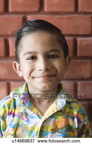 Stock Photo - Portrait of a boy smirking. Fotosearch