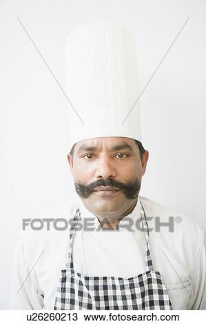 Portrait of a chef looking serious View Large Photo Image Stock Image - Portrait of a chef looking serious. Fotosearch