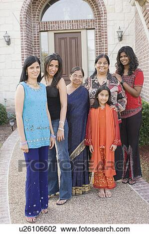 Stock Image - Portrait of a family standing together. Fotosearch