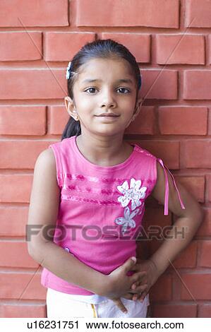 Stock Image - Portrait of a girl smiling. Fotosearch