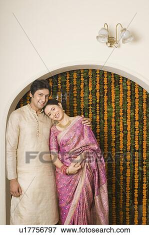 Portrait of a mid adult man arm around a young woman and smiling View Large Photo Image Stock Photo - Portrait of a mid adult man arm around a young woman and smiling. Fotosearch