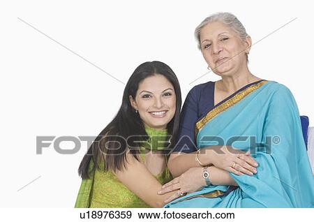 Stock Photo - Portrait of a mother and her daughter smiling. Fotosearch