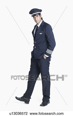 Stock Image - Portrait of a pilot standing with his hands in his pockets. Fotosearch
