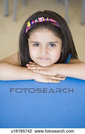 Stock Image - Portrait of a schoolgirl smiling. Fotosearch