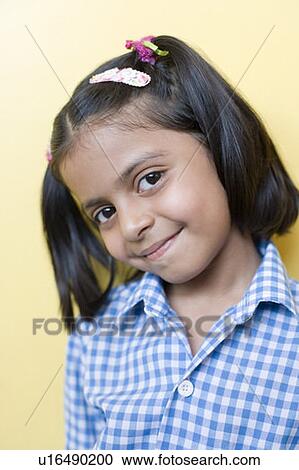 Portrait of a schoolgirl smirking View Large Photo Image Stock Image - Portrait of a schoolgirl smirking. Fotosearch