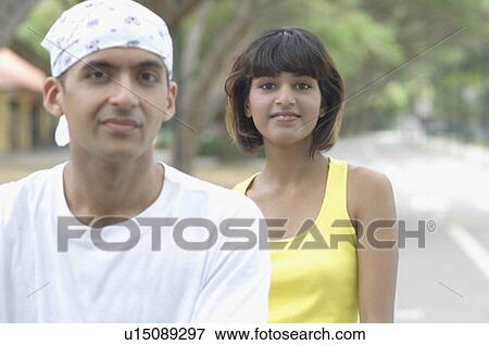 Stock Photo - Portrait of a young couple smiling. Fotosearch