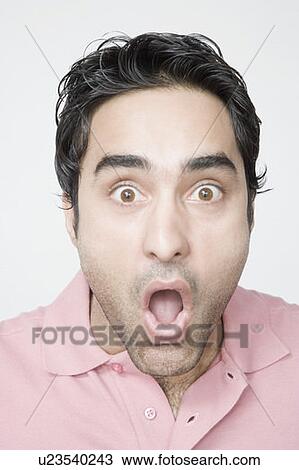 Portrait of a young man looking surprised View Large Photo Image Stock Image - Portrait of a young man looking surprised. Fotosearch