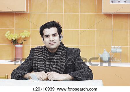 Portrait of a young man wearing a hands free device View Large Photo Image Stock Photo - Portrait of a young man wearing a hands free device. Fotosearch
