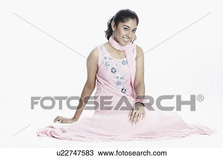 Stock Image - Portrait of a young woman smiling. Fotosearch