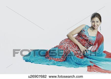 Portrait of a young woman smiling View Large Photo Image Stock Image - Portrait of a young woman smiling. Fotosearch