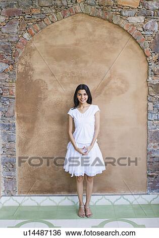 Stock Photograph - Portrait of a young woman smiling. Fotosearch