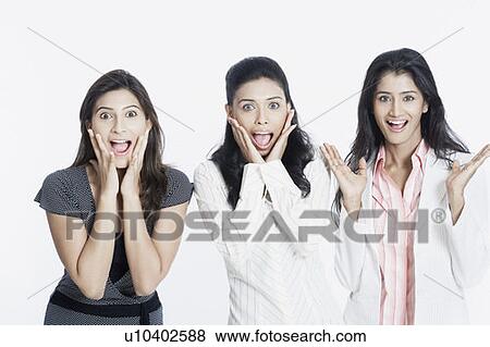 Portrait of three young women looking surprised View Large Photo Image Stock Photo - Portrait of three young women looking surprised. Fotosearch
