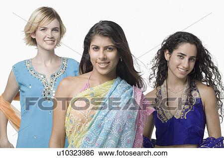 Portrait of three young women standing together in traditional clothing and smiling View Large Photo Image Stock Photograph - Portrait of three young women standing together in traditional clothing and smiling. Fotosearch