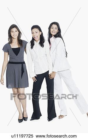 Portrait of three young women standing together and smiling View Large Photo Image Stock Photography - Portrait of three young women standing together and smiling. Fotosearch
