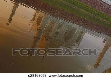 Stock Image - Reflection of a mausoleum in the river, Taj Mahal, Agra, Uttar Pradesh, India. Fotosearch