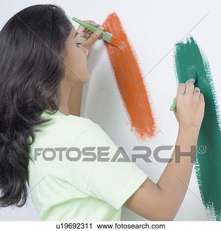 Side profile of a young woman painting the Indian flag on a wall View Large Photo Image Stock Image - Side profile of a young woman painting the Indian flag on a wall. Fotosearch