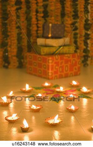 Stack of diwali gifts behind a diwali rangoli View Large Photo Image Stock Photo - Stack of diwali gifts behind a diwali rangoli. Fotosearch