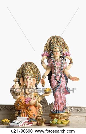 Stock Image - Statue of God Ganesha and Goddess Laxmi. Fotosearch