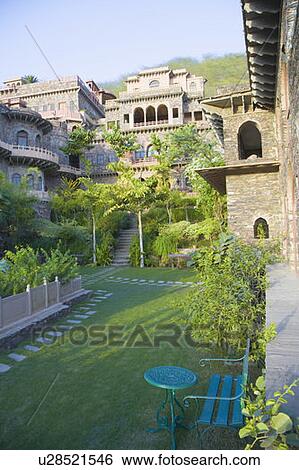 Table and a chair in the courtyard of a fort, Neemrana Fort Palace, Neemrana, Alwar, Rajasthan, India View Large Photo Image Stock Photograph - Table and a chair in the courtyard of a fort, Neemrana Fort Palace, Neemrana, Alwar, Rajasthan, India. Fotosearch