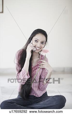 Teenage girl talking on a mobile phone View Large Photo Image Stock Image - Teenage girl talking on a mobile phone. Fotosearch