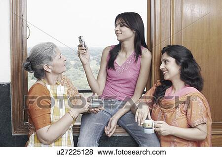 Three women talking to each other View Large Photo Image Stock Photo - Three women talking to each other. Fotosearch
