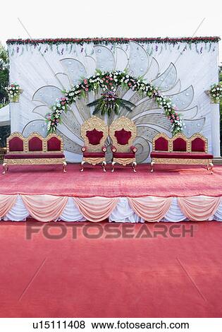 Stock Photo - Two armchairs with couches on a wedding stage. Fotosearch