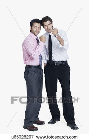 Stock Photo - Two businessmen showing their fist. Fotosearch