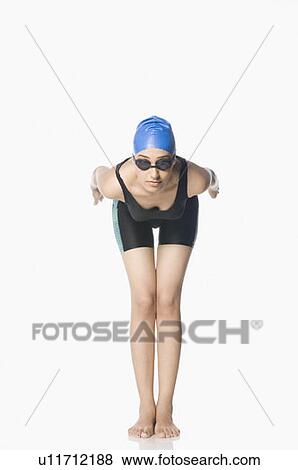 Young woman preparing to dive View Large Photo Image Stock Photo - Young woman preparing to dive. Fotosearch