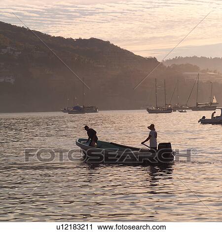 Stock Image - Boats off the coast of Ixtapa. Fotosearch
