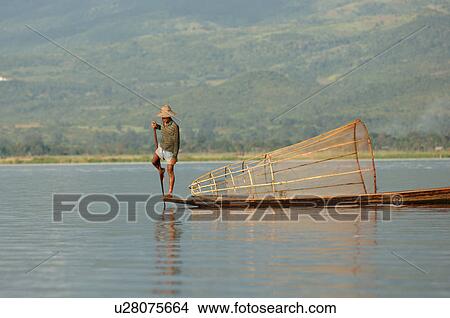 Fisherman in row boat View Large Photo Image Picture - Fisherman in row boat. Fotosearch
