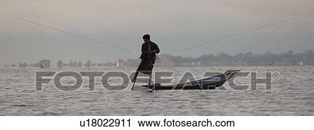 Fisherman leg rowing View Large Photo Image Stock Image - Fisherman leg rowing. Fotosearch