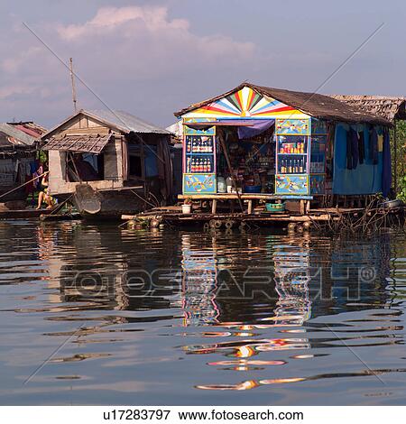 Stock Photo - Huts along the water in Cambodia. Fotosearch