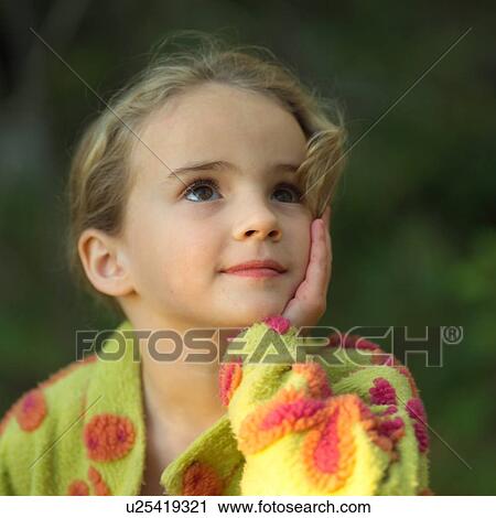Stock Image - 5 - 6 year old girl posing for camera. Fotosearch