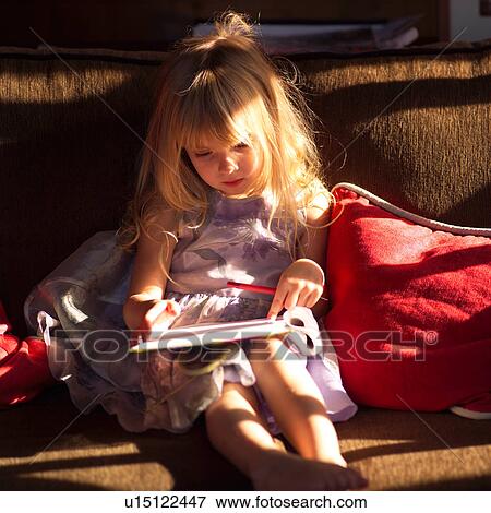 5 year old looking at a book View Large Photo Image Stock Photo - 5 year old looking at a book. Fotosearch