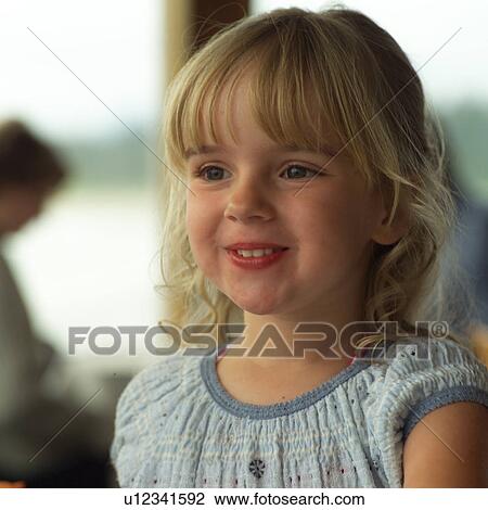 Stock Image - Blond child smiling. Fotosearch