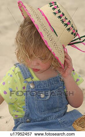 Child holding hat View Large Photo Image Stock Photo - Child holding hat. Fotosearch