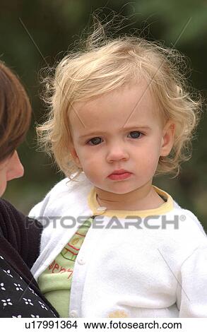 Picture - Close-up of a woman holding a young girl (1-3), Rocky Mountains, Canada. Fotosearch