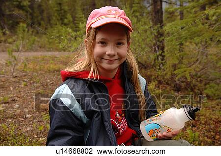 Hiker holding water bottle, Jasper National Park Canada View Large Photo Image Stock Image - Hiker holding water bottle, Jasper National Park Canada. Fotosearch