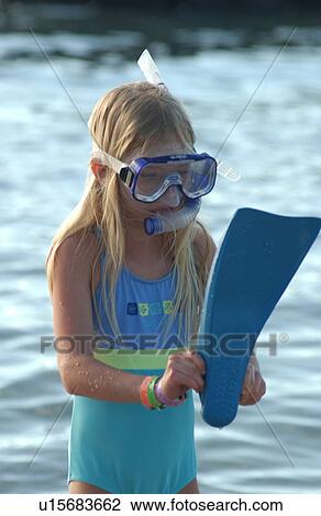 Stock Image - Kids playing on beach - Hawaii. Fotosearch
