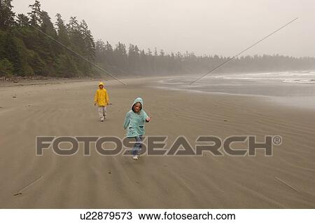 People walking on beach on a cloudy day, Florencia Bay, Vancouver Island, Canada View Large Photo Image Stock Image - People walking on beach on a cloudy day, Florencia Bay, Vancouver Island, Canada. Fotosearch